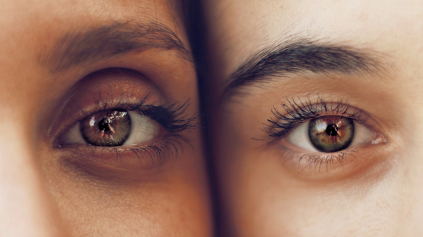 close up image of two brown eyes